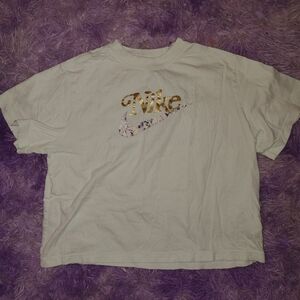 Nike Kids White Tee with Gold and Patterned Logo